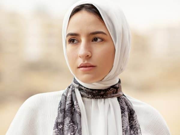 woman in white hijab and white long sleeve shirt